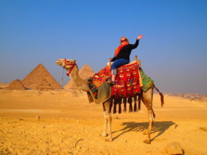 Peg Sewall on a camel in Egypt