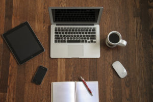 laptop on wooden desk