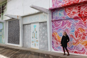 Brianne Miers in front of street art in Asbury Park, New Jersey
