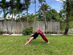 Brianne Miers doing yoga in One Tribe Apparel boho harem pants